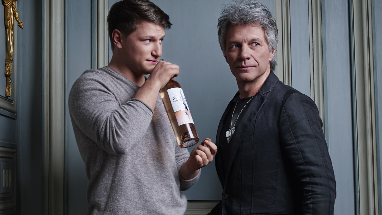 image Bon Jovi and his son holding a bottle of Hampton Water Rosé.