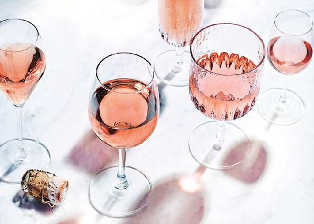 Rosé in a variety of fun shaped glasses.