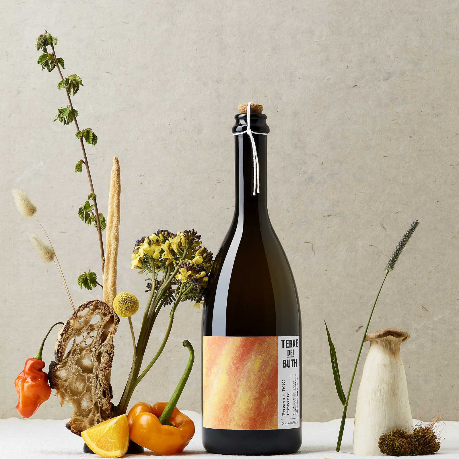 Styled image of a bottle of terre dei buth prosecco DOC frizzante.